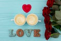 Coffee and roses, wooden background. Royalty Free Stock Photo