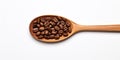 Coffee Seed Heap In Wooden Spoon On White Background. Top View Of Pile Roasted Coffee Beans. Fresh Natural Aroma Drink Royalty Free Stock Photo