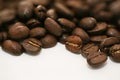 Coffee seeds spilling - beans on white background Royalty Free Stock Photo