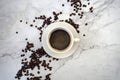 Cup of coffee with beans, with marble background