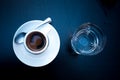 Coffee served in a traditional italian style with glass of water. Top view. Morning coffee in bar. Espresso geometrical Royalty Free Stock Photo