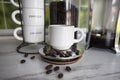 Coffee shop background French press window and espresso cups jar of java beans Royalty Free Stock Photo