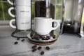 Coffee shop background French press window and espresso cups jar of java beans Royalty Free Stock Photo