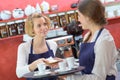 Coffee shop baristas working