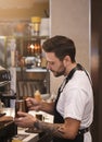 Professional Barista Making Coffee Using Coffee-Machine Standing In Cafe Royalty Free Stock Photo