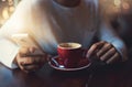 Coffee shop connections. a young man using his cellphone in a coffee shop. Royalty Free Stock Photo