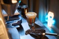 Coffee shop counter with coffee machine scoop with beans and cup of cappuccino Royalty Free Stock Photo