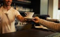 Coffee shop customer, happy people and barista hands with tea cup, espresso or matcha for morning hydration. Hospitality Royalty Free Stock Photo