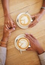 Coffee shop, dating and couple holding hands from top view at cafe. Married boyfriend and girlfriend touching each other Royalty Free Stock Photo