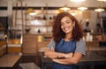 Coffee shop, happy barista and portrait of woman in cafe for service, working and crossed arms. Small business owner Royalty Free Stock Photo