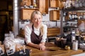 Coffee shop owner standing behind the counter Royalty Free Stock Photo