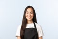 Coffee shop, small business and startup concept. Close-up of cheerful asian female employee, cafe owner or barista in Royalty Free Stock Photo