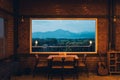 In a coffee shop, a table and a large window view the mountains Royalty Free Stock Photo