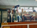 Coffee shop worker preparing to grind coffee bean