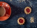 Coffee with shortbread cookies, curly cookies with strawberry jam Royalty Free Stock Photo