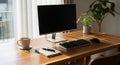 Desktop computer setup on a wooden desk with a coffee mug and a notebook (1156 Royalty Free Stock Photo