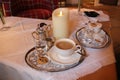 Coffee with Silver on Table with Candle