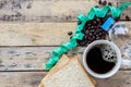 Coffee,slice of bread,measuring tape and coffee beans on wooden