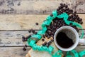 Coffee,slice of bread,measuring tape and coffee beans on wooden