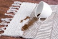 Coffee spilling from cup on carpet. Domestic life. The concept of cleaning stains. Royalty Free Stock Photo