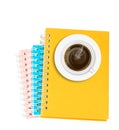 Coffee on stack of ring binder book or notebook isolated on whit Royalty Free Stock Photo