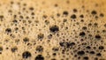 Coffee surface texture. Foam bubbles in detail. Aromatic hot drink