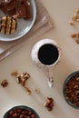 Coffee, Sweets, Nuts and Cocoa on White Background