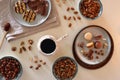 Coffee, Sweets, Nuts and Cocoa on White Background