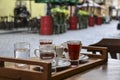 Coffee on table on cozy terrace street cafe in old European town