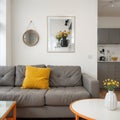 Coffee table in front of grey couch in scandinavian living room Royalty Free Stock Photo