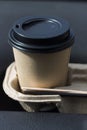 coffee take-away in a paper cup in the car. Royalty Free Stock Photo