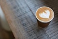 Coffee in take out cup on the table Royalty Free Stock Photo