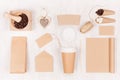 Coffee takeaway set mockup for brand - brown paper cup, blank notebook, packet, label, stationery, coffee beans, sugar, heart. Royalty Free Stock Photo