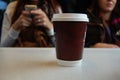 Coffee takeout cup on a table Royalty Free Stock Photo