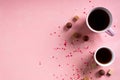 Coffee tea cups, sweets candy chocolate on pink hearts background. Valentines day 14 february minimal concept Royalty Free Stock Photo