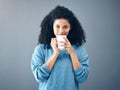 Coffee, tea and portrait of black woman drinking an espresso in a cup isolated in a studio gray background. Morning Royalty Free Stock Photo