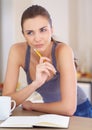 Coffee, thinking and writing in a journal with a woman in the kitchen of her home in the morning. Relax, idea and diary Royalty Free Stock Photo