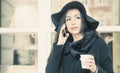Coffee time. Business woman holding  phone and enjoying coffee i Royalty Free Stock Photo