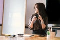 Coffee time, Businesswoman working on desk office with using a calculator Royalty Free Stock Photo