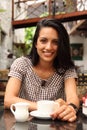 Coffee time at cafe for smiling young woman Royalty Free Stock Photo