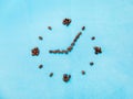 Coffee time concept. Clock made from coffee beans