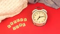 Coffee time morning concept, old vintage alarm clock on red retro background, knitted sweaters Royalty Free Stock Photo