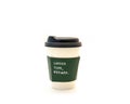 Coffee time refined text on green corrugated hot cup sleeves jackets holder kraft paper of white hot coffee cup with black lid Royalty Free Stock Photo