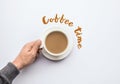 Coffee time text with male hand holding cup of coffee.business a Royalty Free Stock Photo