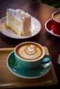 Coffee time in the wood table cafe , drink coffee and tasty cake Royalty Free Stock Photo