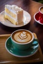 Coffee time in the wood table cafe , drink coffee and tasty cake Royalty Free Stock Photo