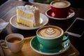 Coffee time in the wood table cafe , drink coffee and tasty cake Royalty Free Stock Photo