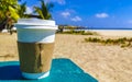 Coffee to go mug on the beach sand sea waves Royalty Free Stock Photo