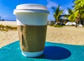Coffee to go mug on the beach sand sea waves Royalty Free Stock Photo