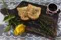 Coffee, toast and roses, romantic breakfast on Valentine's Day. Served on an wooden board with copy space Royalty Free Stock Photo